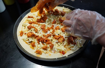 Cooks make delicious food during Asian Cuisine Festival in Beijing