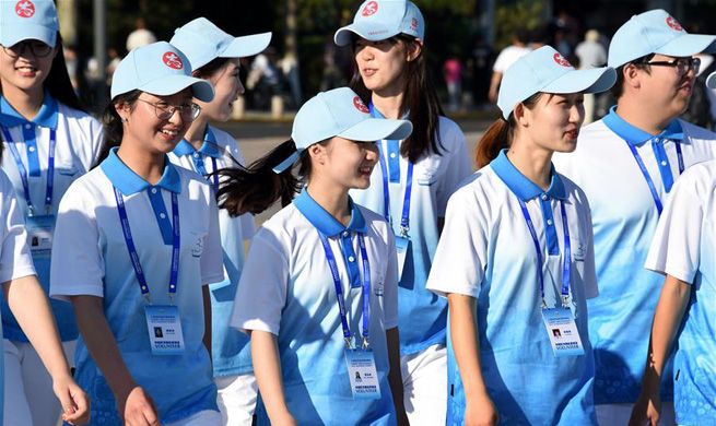 Volunteers seen on street in host city of 18th SCO Summit