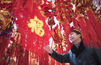 People purchase goods for upcoming Spring Festival in Wuhan, C China